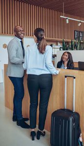 a lady servicing two customers at a counter