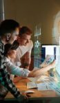 men and woman looking at screen