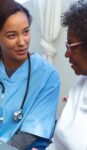 doctor talking to senior patient